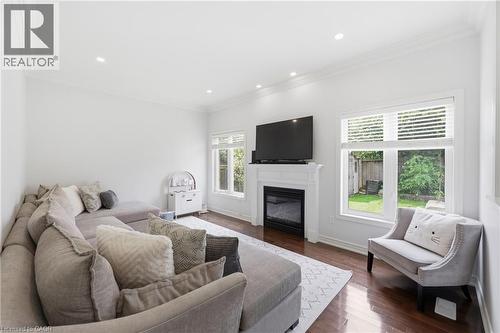 Hardwood flooring, recessed lighting, and crown molding - 738 Fourth Line, Milton, ON - Indoor Photo Showing Living Room With Fireplace