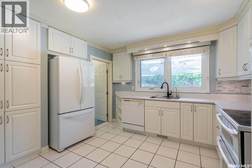 24 Mayfair Crescent, Regina, SK - Indoor Photo Showing Kitchen With Double Sink