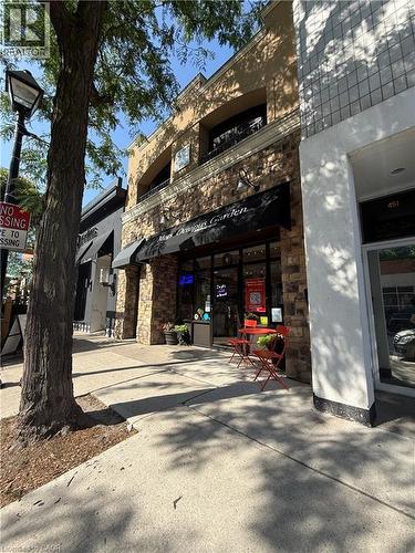 Stone facade with a prominent awning - 453 Brant Street, Burlington, ON 