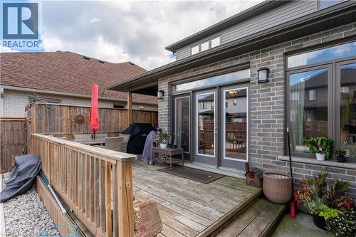 Expansive wood deck with a privacy fence, complemented by a brick and siding exterior and large windows - 1061 Eagletrace Drive Unit# 174, London, ON - Outdoor With Deck Patio Veranda With Exterior