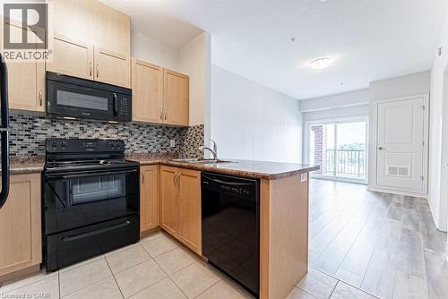 3200 Regional Road 56 Unit# 310, Binbrook, ON - Indoor Photo Showing Kitchen With Double Sink
