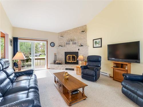 34 Thorvaldson Drive, Arnes, MB - Indoor Photo Showing Living Room With Fireplace