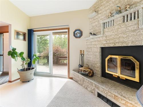 34 Thorvaldson Drive, Arnes, MB - Indoor Photo Showing Living Room With Fireplace