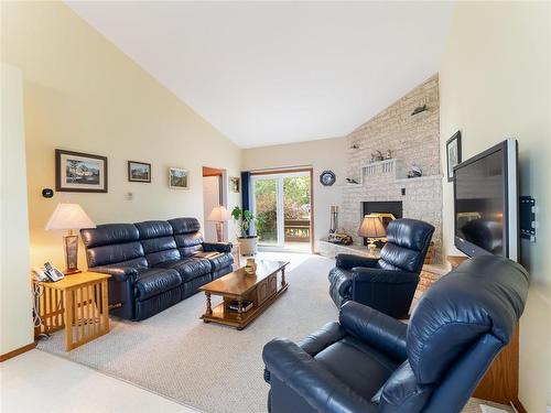 34 Thorvaldson Drive, Arnes, MB - Indoor Photo Showing Living Room With Fireplace