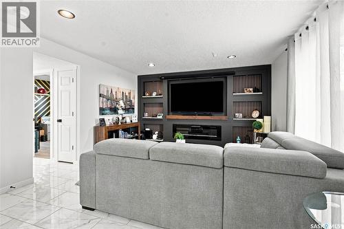 107 Hall Crescent, Saskatoon, SK - Indoor Photo Showing Living Room With Fireplace