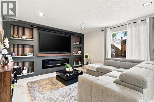 107 Hall Crescent, Saskatoon, SK - Indoor Photo Showing Living Room With Fireplace