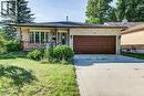 Brick exterior with an attached garage, concrete driveway, and front porch - 3 Cora Drive, Kitchener, ON  - Outdoor 
