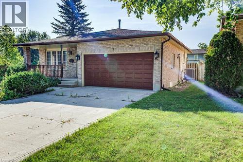 Brick exterior with covered front porch, attached garage, and concrete driveway - 3 Cora Drive, Kitchener, ON - Outdoor