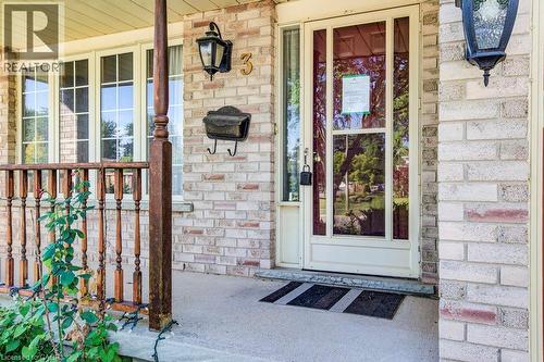 Brick exterior facade with a covered porch and decorative balusters - 3 Cora Drive, Kitchener, ON - Outdoor