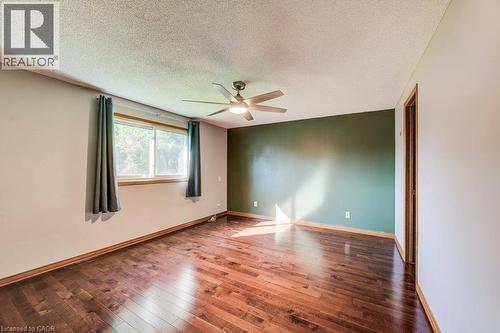 Hardwood-style flooring with a natural finish - 3 Cora Drive, Kitchener, ON - Indoor Photo Showing Other Room