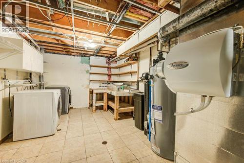 Tiled flooring with exposed ceiling joists and utility access - 3 Cora Drive, Kitchener, ON - Indoor Photo Showing Laundry Room