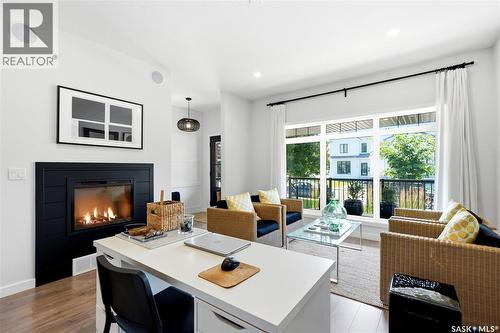 1039 4Th Street E, Saskatoon, SK - Indoor Photo Showing Living Room With Fireplace