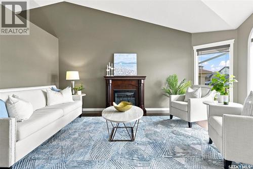 211 Crenshaw Way, Warman, SK - Indoor Photo Showing Living Room With Fireplace