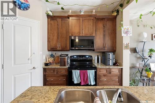 150 Lynd Crescent, Saskatoon, SK - Indoor Photo Showing Kitchen With Double Sink