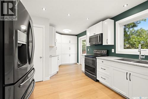 48 French Crescent, Regina, SK - Indoor Photo Showing Kitchen With Double Sink