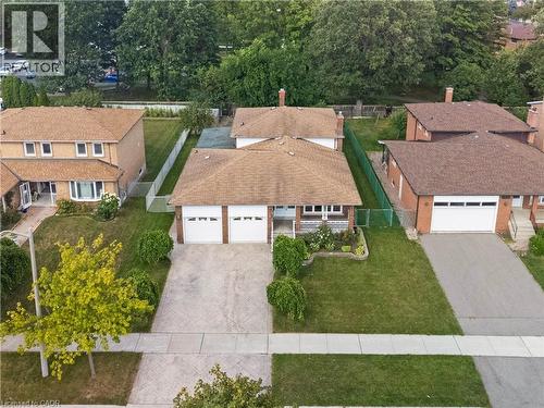 Single-story residence featuring a two-car garage, concrete driveway, and front landscaping - 2535 Privet Crescent, Mississauga, ON - Outdoor
