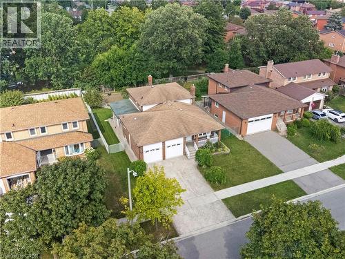 Brick exterior, attached two-car garage, concrete driveway, front yard landscaping, and mature trees - 2535 Privet Crescent, Mississauga, ON - Outdoor