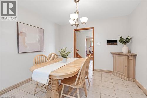 Recessed wall niche, built-in corner cabinet with stone top, and ceiling-mounted light fixture - 2535 Privet Crescent, Mississauga, ON - Indoor Photo Showing Dining Room
