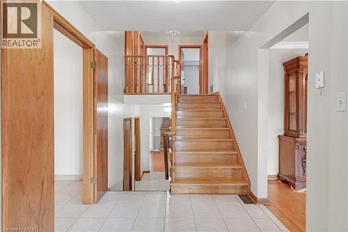Wood staircase with matching wood railing - 2535 Privet Crescent, Mississauga, ON - Indoor Photo Showing Other Room