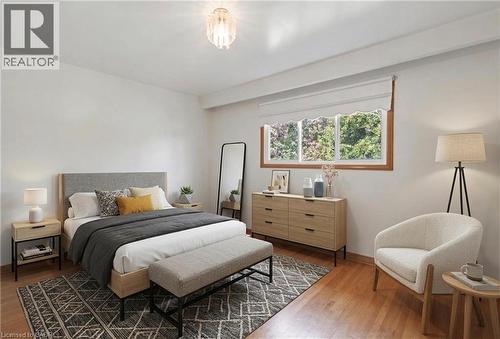 *VIRTUALLY STAGED* Hardwood-style flooring throughout - 2535 Privet Crescent, Mississauga, ON - Indoor Photo Showing Bedroom