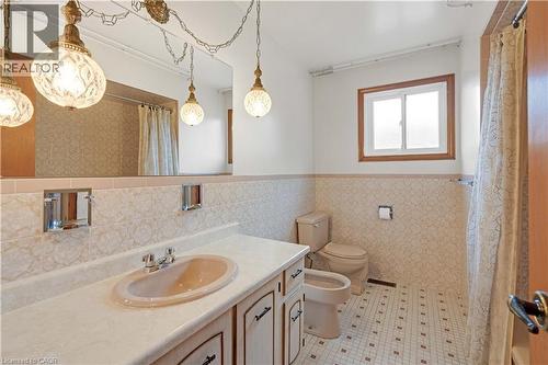Bathroom with a vanity, integrated sink, and an expansive wall mirror - 2535 Privet Crescent, Mississauga, ON - Indoor Photo Showing Bathroom