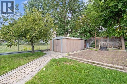 Paved pathway, mature trees, metal-sided shed, raised garden bed, chain-link fence - 2535 Privet Crescent, Mississauga, ON - Outdoor