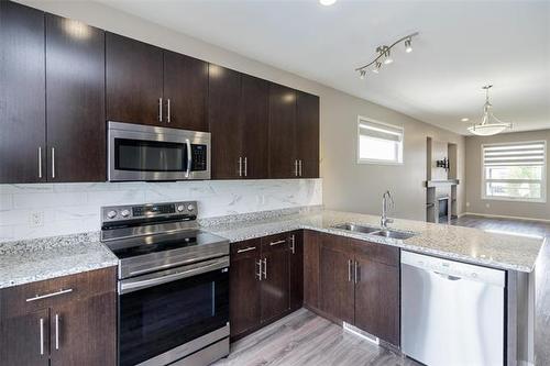 154 Philip Lee Dr, Winnipeg, MB - Indoor Photo Showing Kitchen With Double Sink