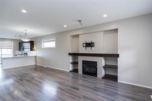 154 Philip Lee Dr, Winnipeg, MB - Indoor Photo Showing Living Room With Fireplace