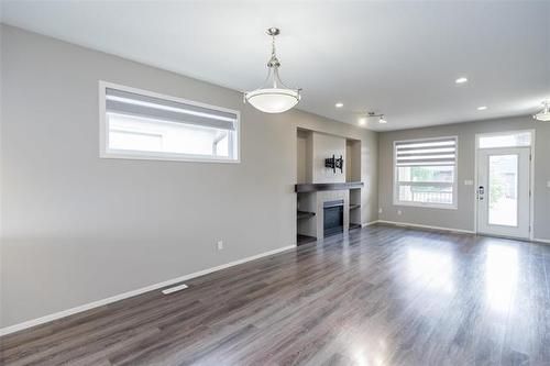 154 Philip Lee Dr, Winnipeg, MB - Indoor Photo Showing Living Room With Fireplace