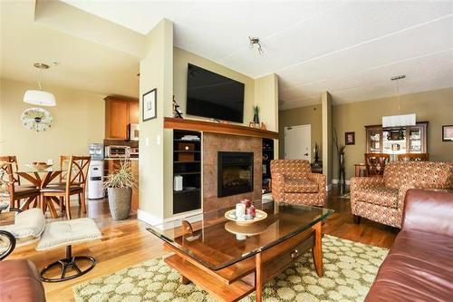 2204-84 Snow St, Winnipeg, MB - Indoor Photo Showing Living Room With Fireplace