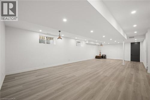 Lower level with kitchen electrical and plumbing roughed in...just ready for cabinetry and appliances! - 163 Redtail Street, Kitchener, ON - Indoor Photo Showing Other Room