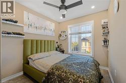 Recessed lighting, ceiling fan, wood-finish flooring, and a large window with blinds - 