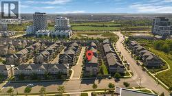 Residential neighborhood with townhome-style properties and nearby multi-story buildings - 
