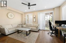 Recessed lighting, wood-finish flooring, ceiling fan, sliding glass door, and white window blinds - 