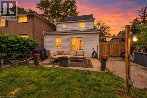 Twilight image has been AI-generated from the original exterior photo for illustrative purposes - 9 Aylmer Street, Brantford, ON 