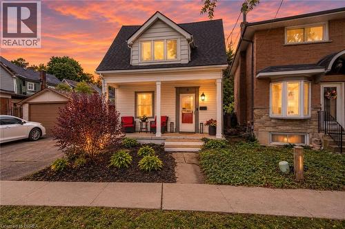 Twilight image has been AI-generated from the original exterior photo for illustrative purposes - 9 Aylmer Street, Brantford, ON 