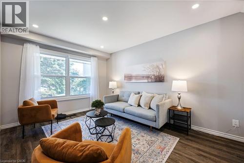 Recessed ceiling lighting, wood-finish flooring, light-toned wall paint, and a large window with white trim - 364 Stoneheight Place, Waterloo, ON 