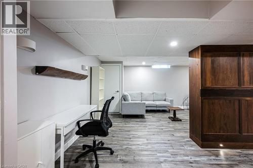 Recessed lighting, wood-finish flooring, white walls, and a built-in wood-paneled feature - 364 Stoneheight Place, Waterloo, ON 