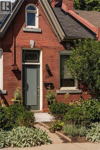 Brick facade with an arched window - 29 Steven Street, Hamilton, ON 