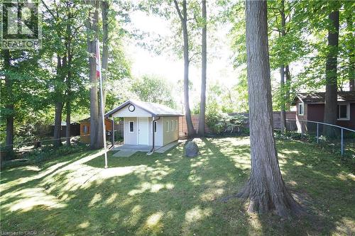 Detached utility structure with siding exterior and covered entryway - 185 Southwood Drive, Kitchener, ON 
