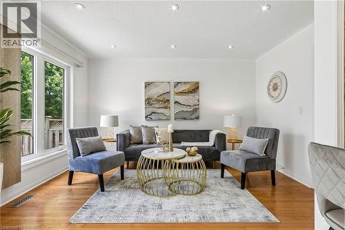 Recessed lighting, wood-finish flooring, and white walls with crown molding - 1373 Quest Circle, Mississauga, ON 