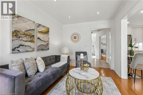 Hardwood-style flooring throughout, recessed lighting, and a brightly painted interior - 1373 Quest Circle, Mississauga, ON 