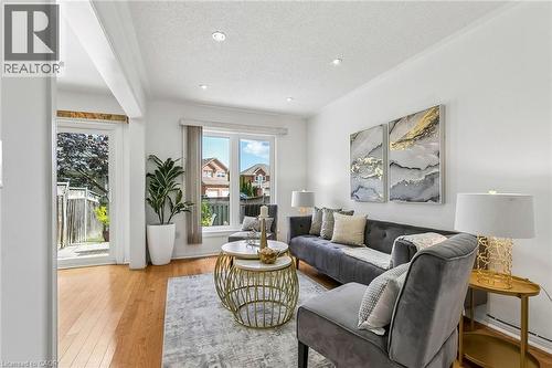 Recessed lighting, wood-finish flooring, white walls, and a sliding glass door - 1373 Quest Circle, Mississauga, ON 