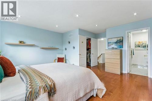 Recessed lighting, wood-finish flooring, light blue wall finishes, floating shelves, and a built-in closet - 1373 Quest Circle, Mississauga, ON 