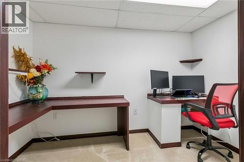 Built-in corner desk, wall-mounted shelving, and carpet flooring - 1373 Quest Circle, Mississauga, ON 