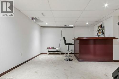Finished basement featuring a built-in bar, recessed lighting, and carpet flooring - 1373 Quest Circle, Mississauga, ON 