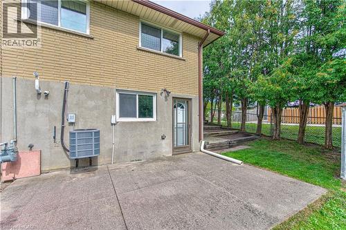 Concrete patio, door from basement level - 21 Vicmount Drive, Kitchener, ON 