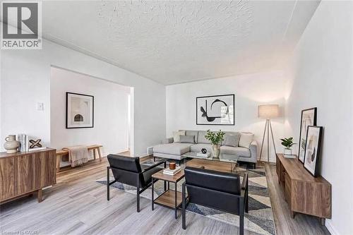 Virtually staged photo in Living room - 21 Vicmount Drive, Kitchener, ON 