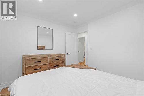 Recessed ceiling lighting, light wood-finish flooring, and white walls - 4236 Longmoor Drive, Burlington, ON 