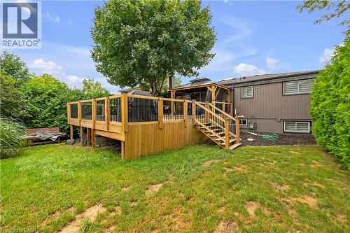 Expansive backyard featuring a multi-level wood deck, a covered gazebo, and mature landscaping - 4236 Longmoor Drive, Burlington, ON 